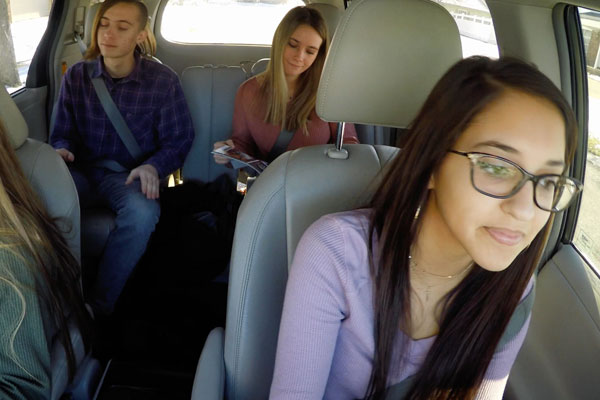4 teens in a car