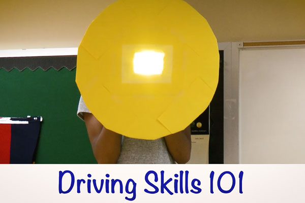 a cut out of a sun with a chyron that reads driving skills 1010