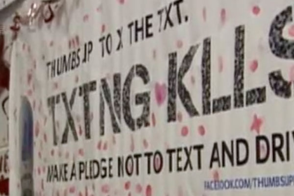a mural with texting kills and signatures and thumb-prints