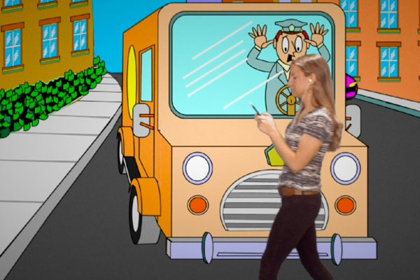 cartoon of a bus about to run into a real life person texting 