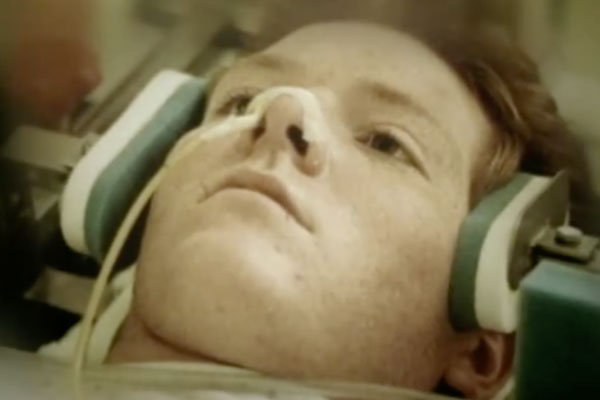 a young man in a head brace